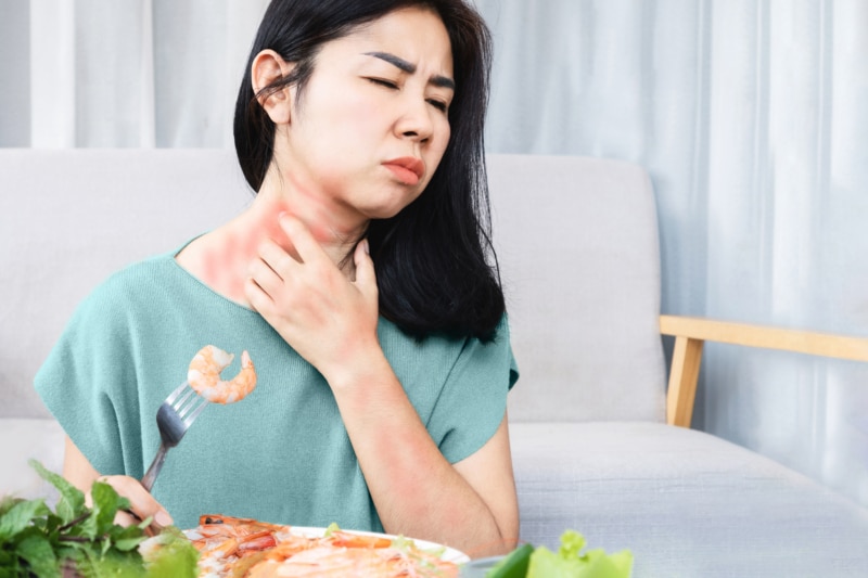 woman having an allergic response to shellfish