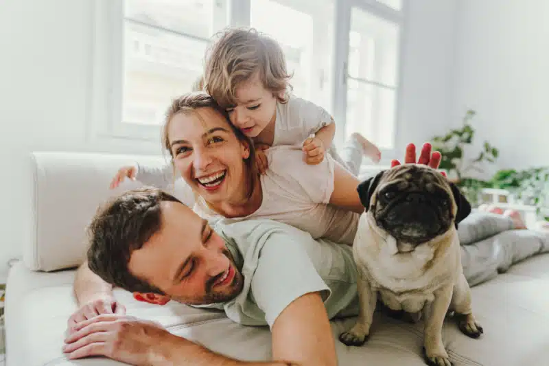 Family playing with dog