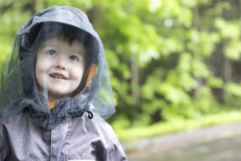 Boy wearing a hat with netting